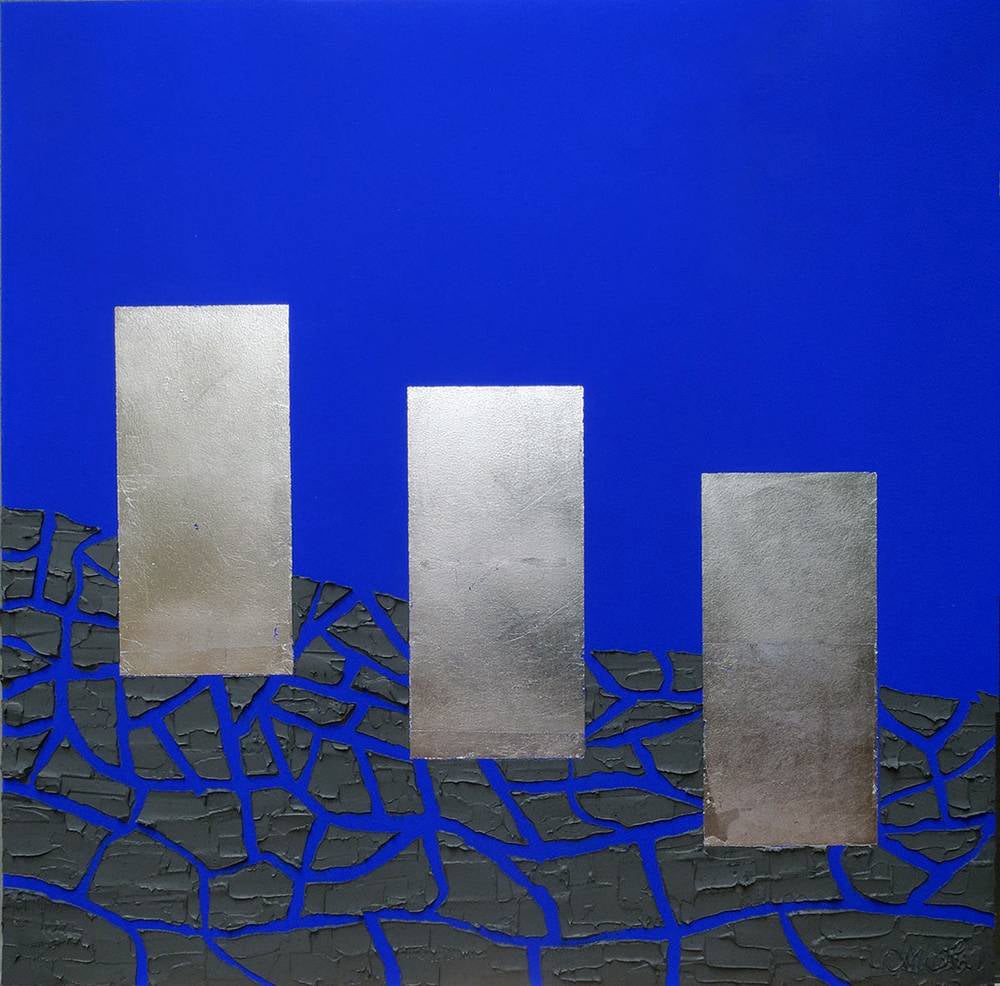 Feuilles d'argent sur fond bleu